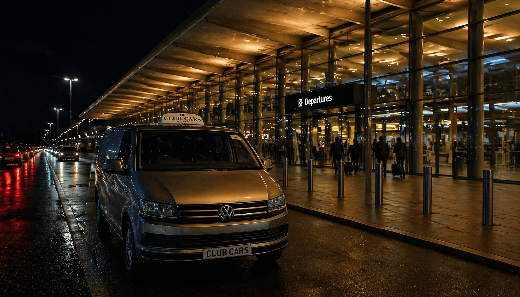 Club Cars minivan at airport departures at night
