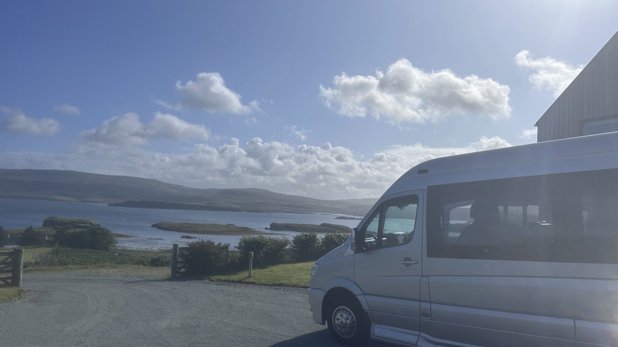 Black Mercedes V-Class on a Scottish lochside road