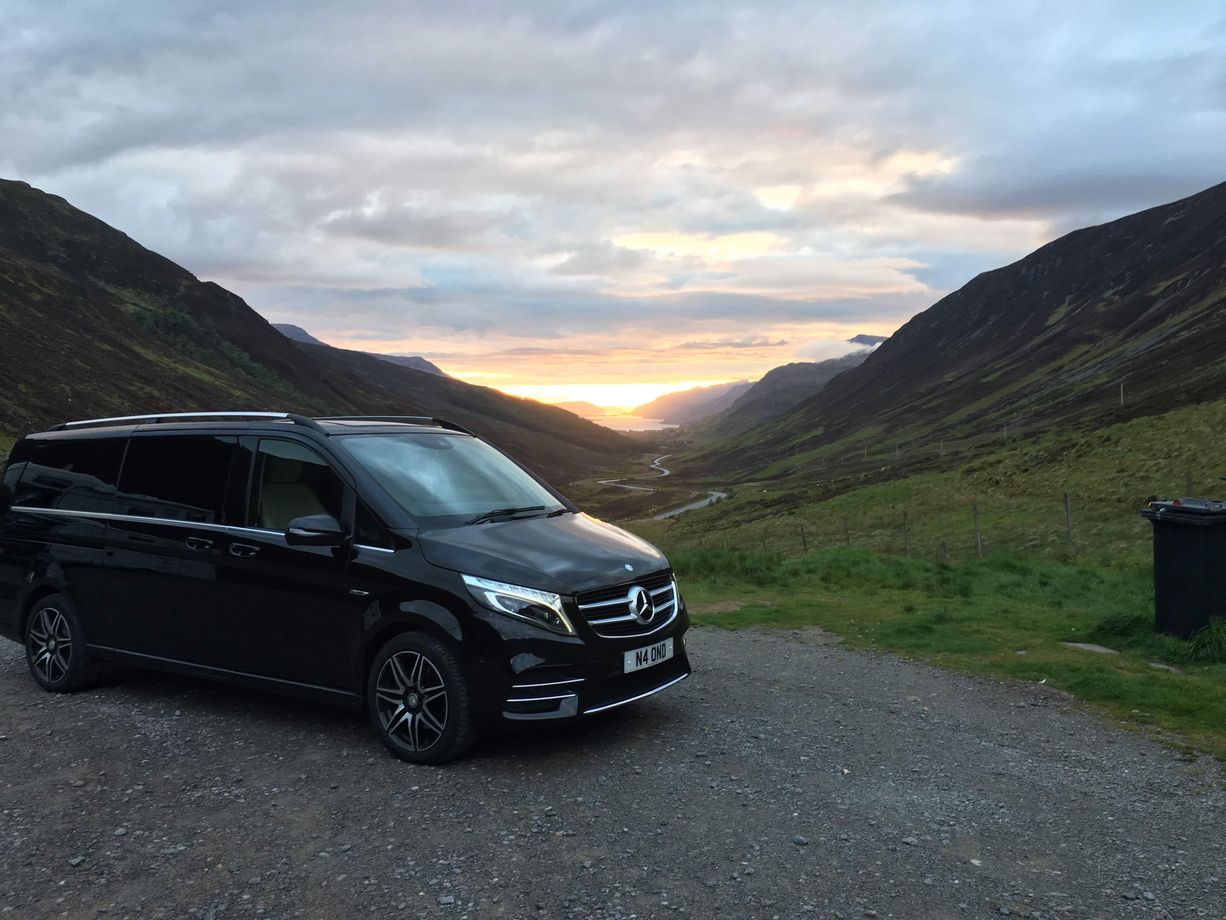 Black Mercedes V-Class at sunset in the Scottish Highlands