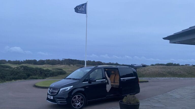 Black Mercedes V-Class with door open at Kingsbarns Golf Club