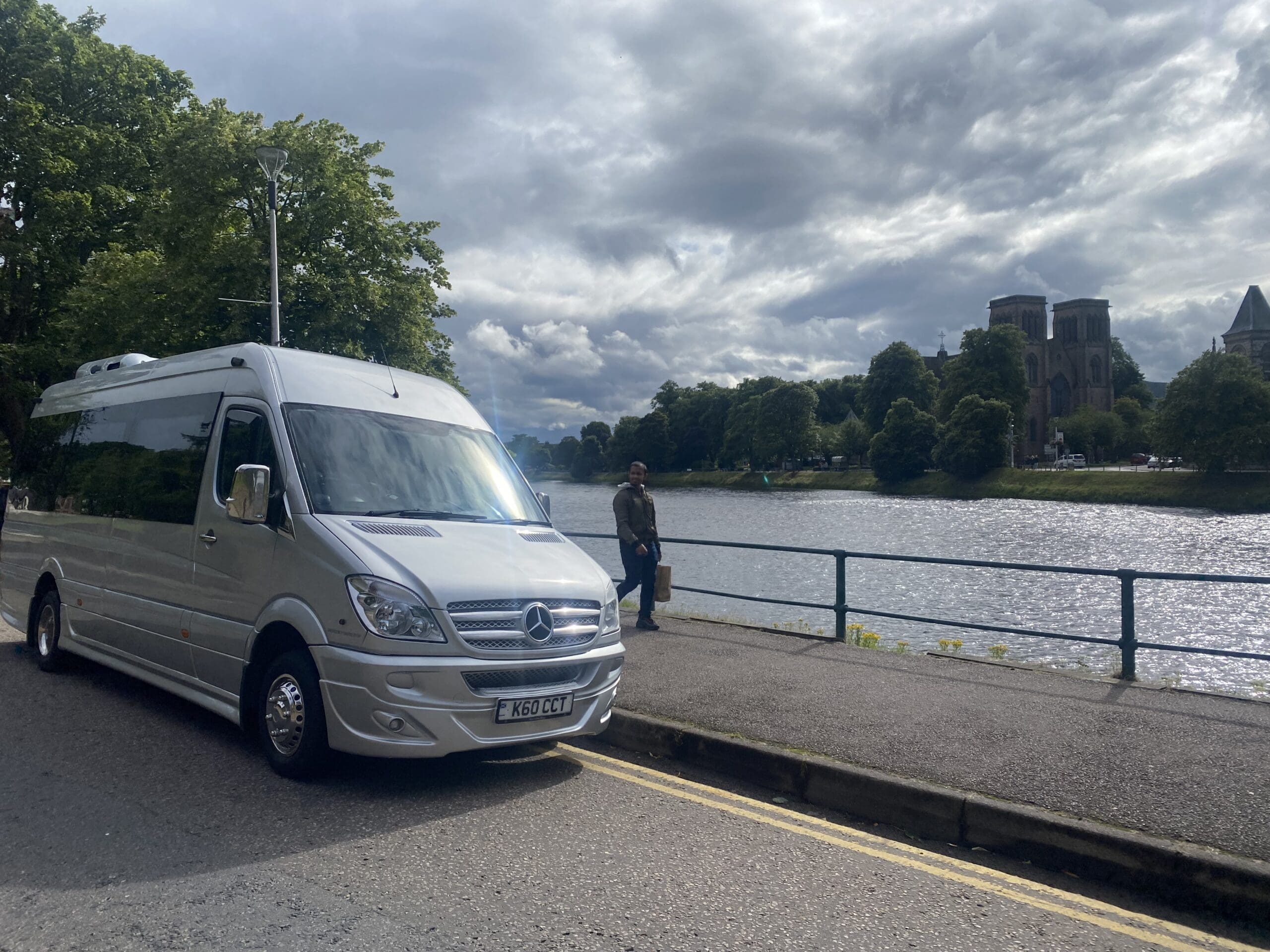 Silver Mercedes Sprinter by the River Ness in Inverness