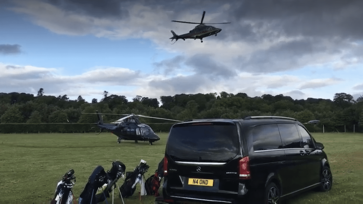 Mercedes V-Class beside arriving helicopters at a Scottish golf estate